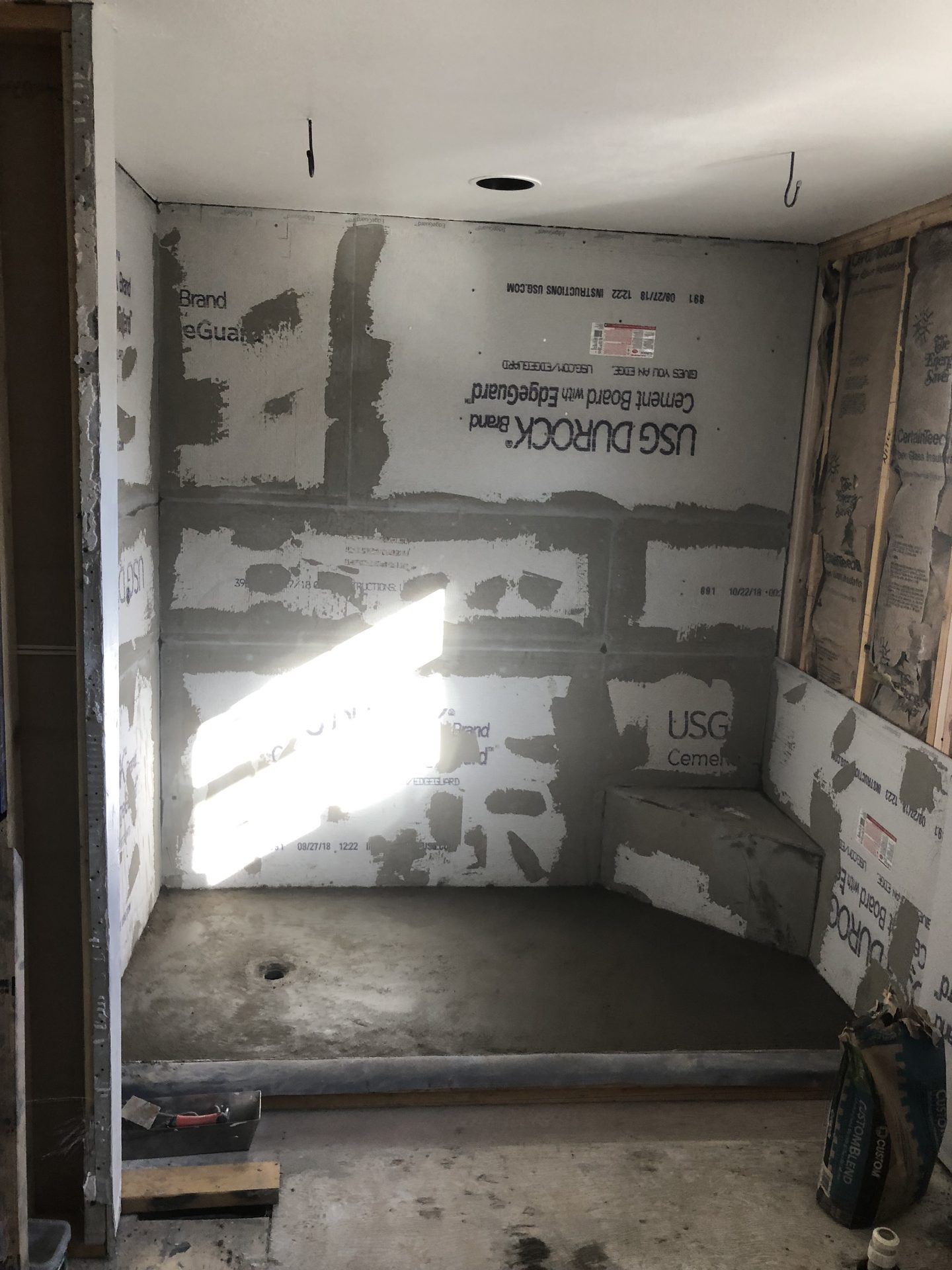 Shower stall lined with cement board and a mortar pan