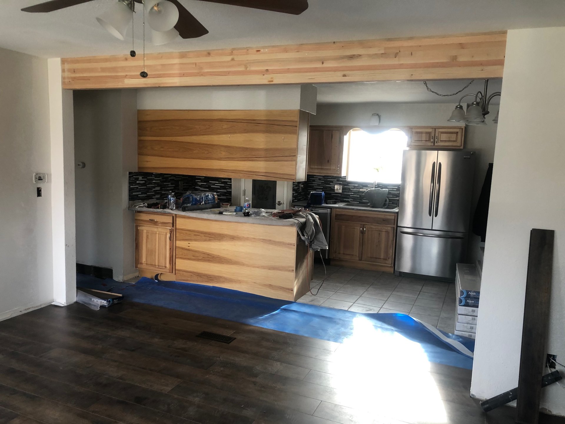 Beam in place with mosaic kitchen and flooring boxes on site