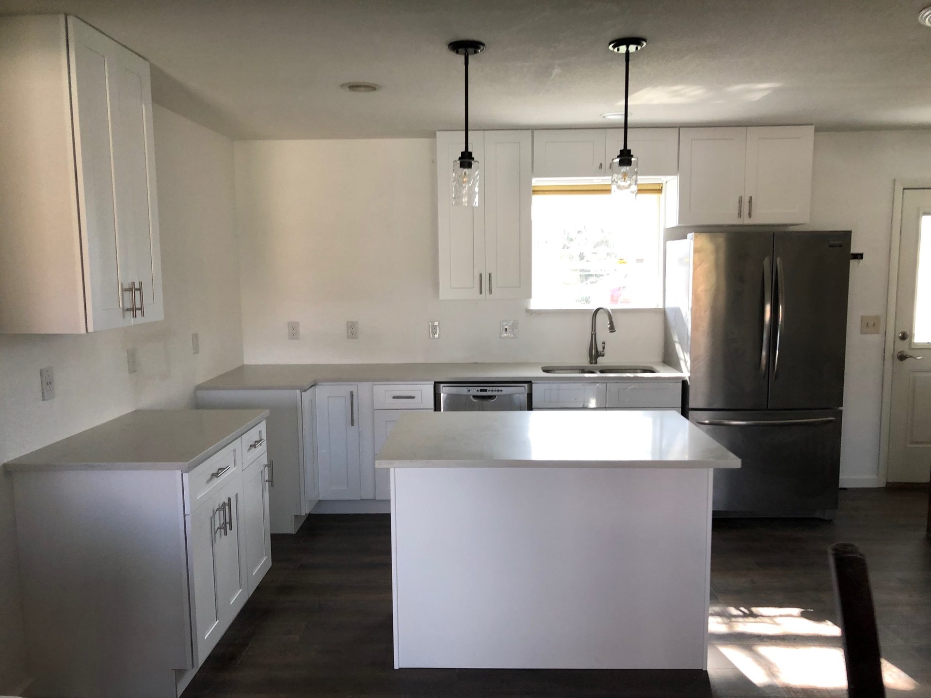 Finished white shaker kitchen with island